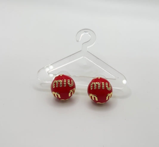 Red M earrings